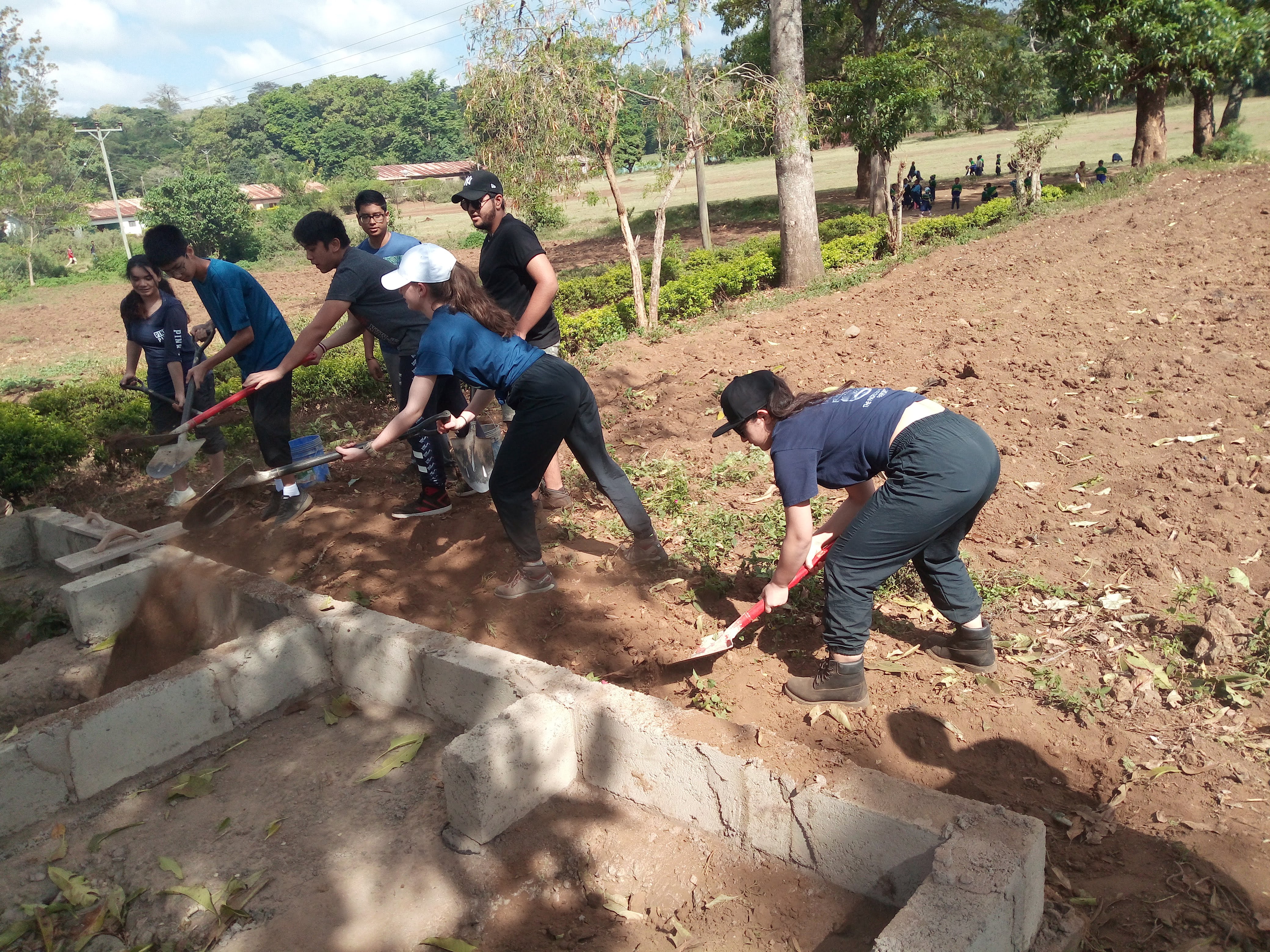 International volunteers with community