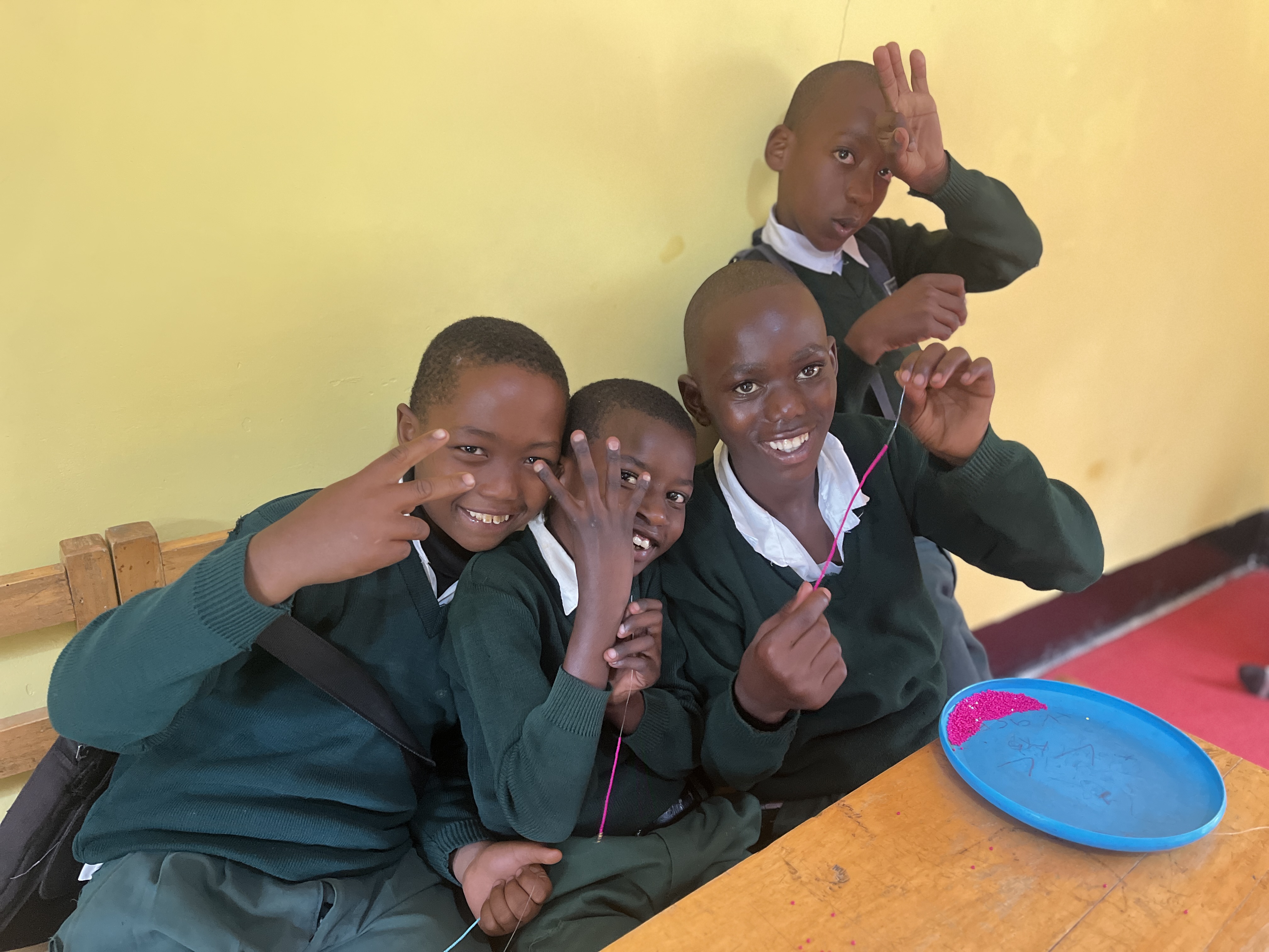 Child crafting with beads